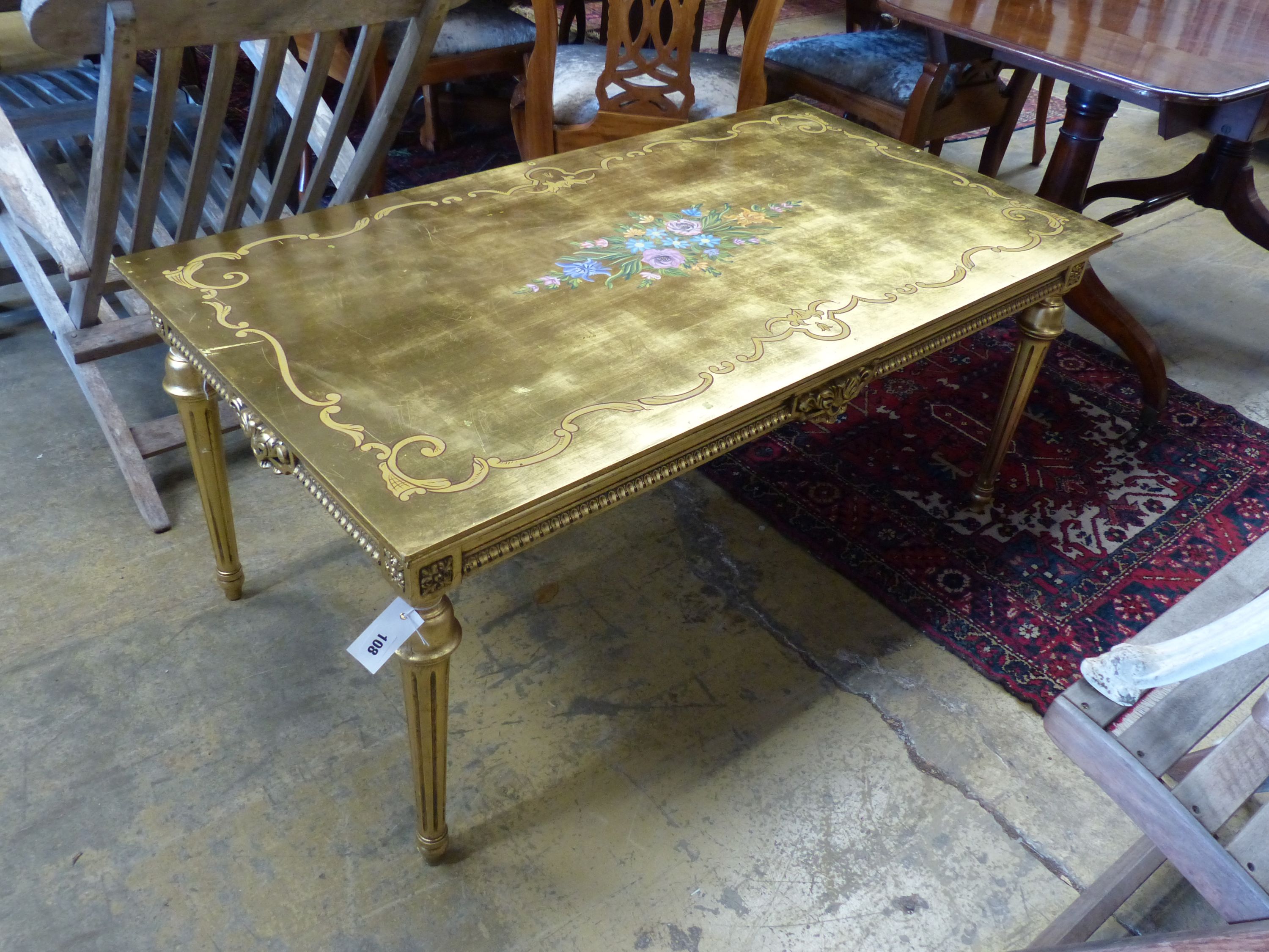 A rectangular painted gilt coffee table, width 125cm, depth 67cm, height 55cm